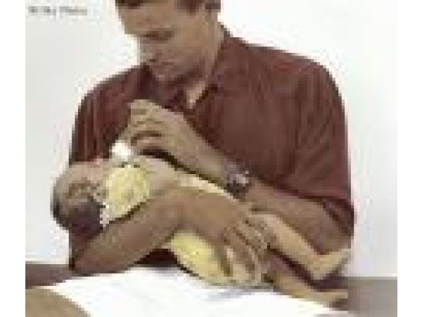 Father Feeding Baby