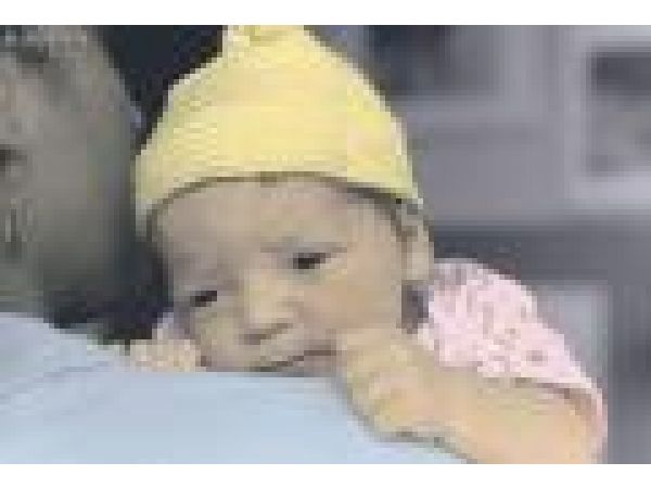 Newborn in Yellow Cap