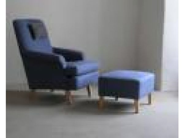 Fridhem armchair and ottoman upholstered in Atalan