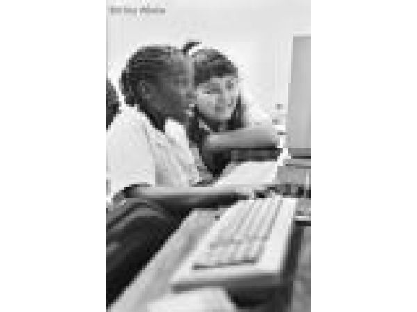 Girls sharing a computer at science program