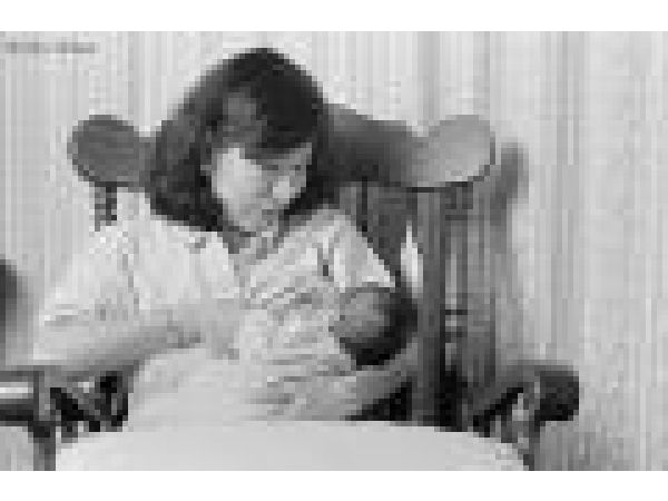 Asian Mother Nursing Newborn